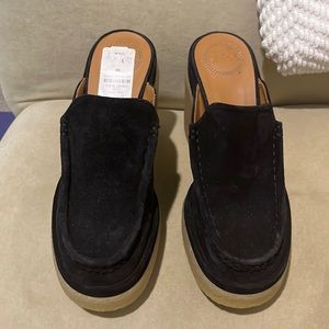 Black suede Chloe mules with tan rubber sole